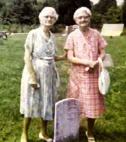 Pearl Saunders and her sister Carroll Saunders Cathey  
at the graveside of their 'Big Sister', Maggie L. Saunders, on August 19, 1973.